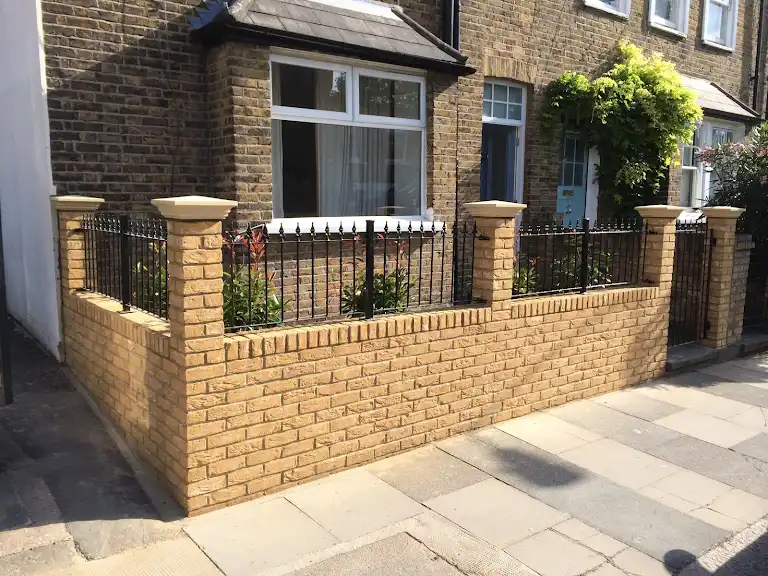 A brick wall outside a house